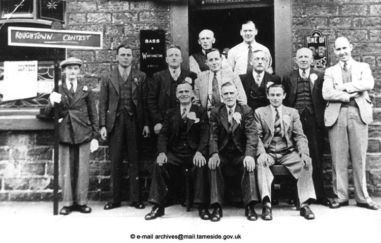 First-band-concert-held-in-Roughtown,-committee-members-outside-the-Lower-Church-Inn,-Stockport-Road